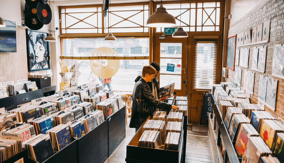 A record store with two people looking through records.