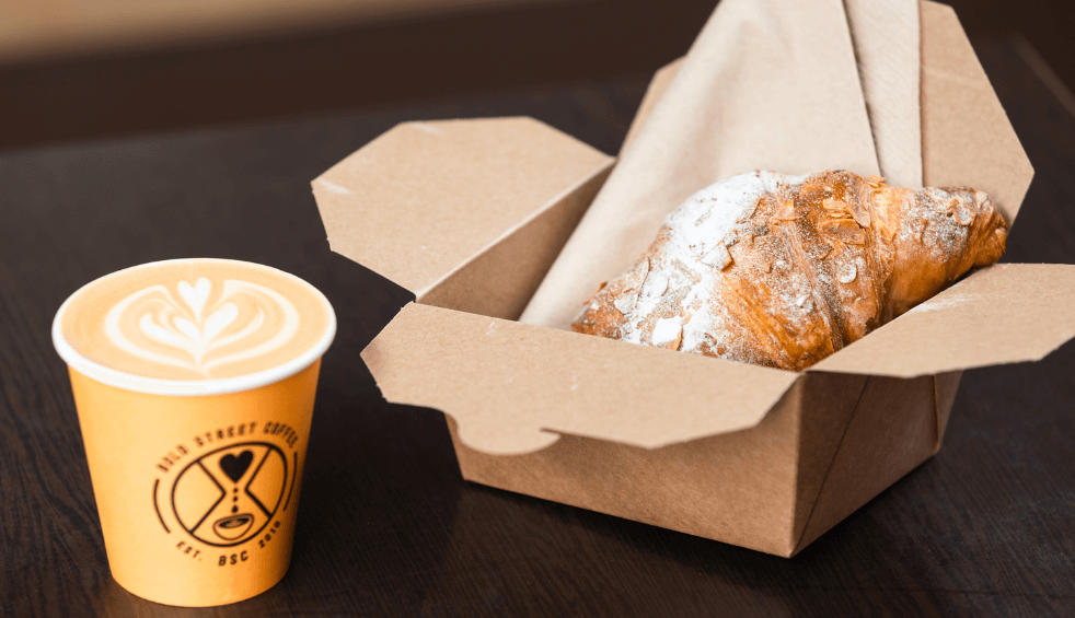 A pastry and a takeaway coffee.