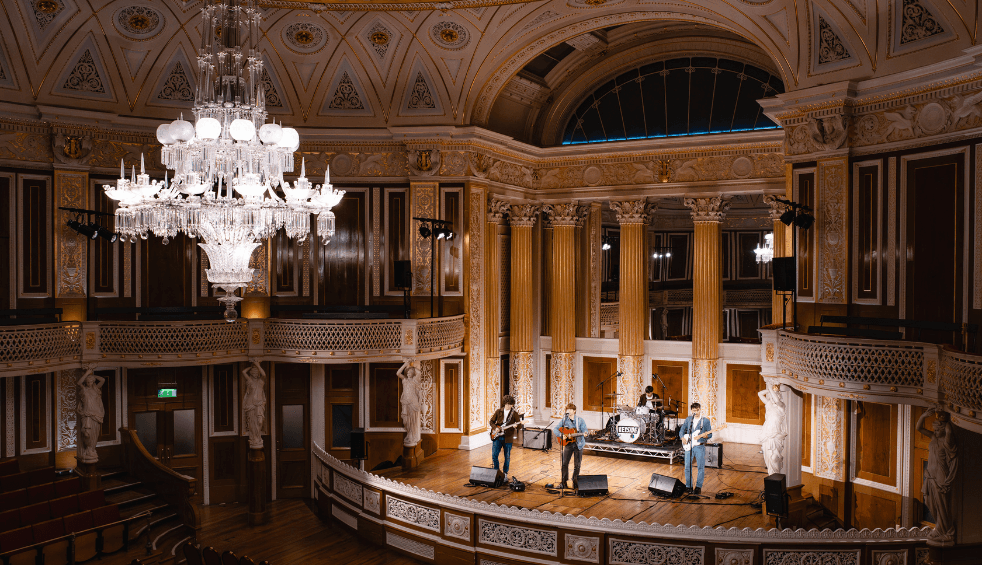 A band on a stage inside the concert room at St George's Hall