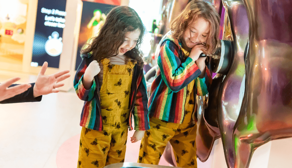 Two children looking at an exhibition at Eureka