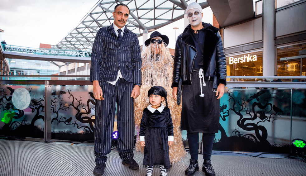 Four people dressed up as characters from the Addams Family.