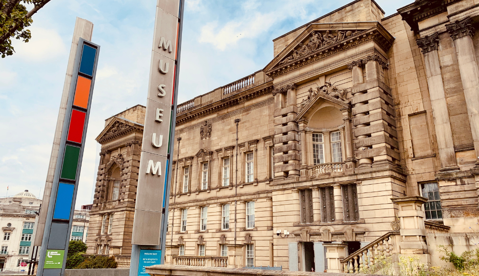 Outside of the World Museum in Liverpool, which is an old brick building.