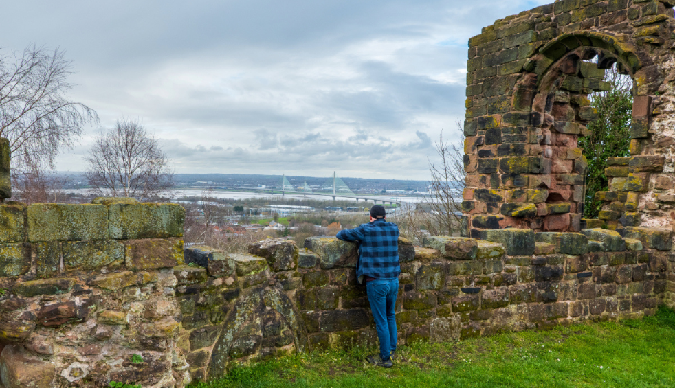 A man looking out from Halton Castle.