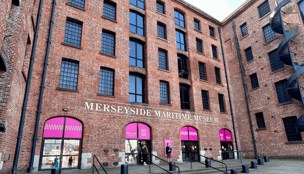 Outside of the Maritime Museum with the name of the venue in large letters above the doors.
