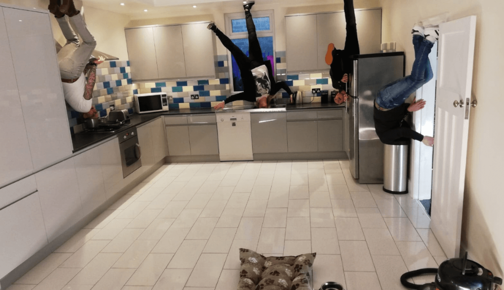 An optical illusion that looks like people standing on a ceiling
