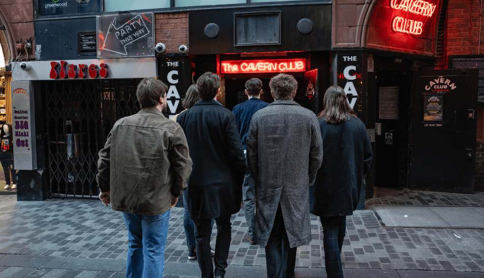 The band red rum club walking into the cavern.