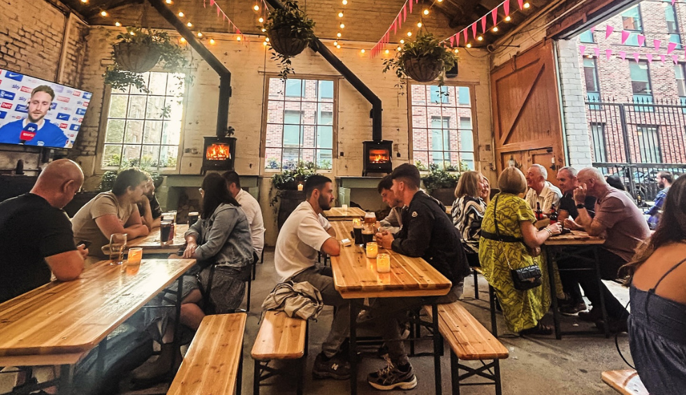 People drinking in The Monro