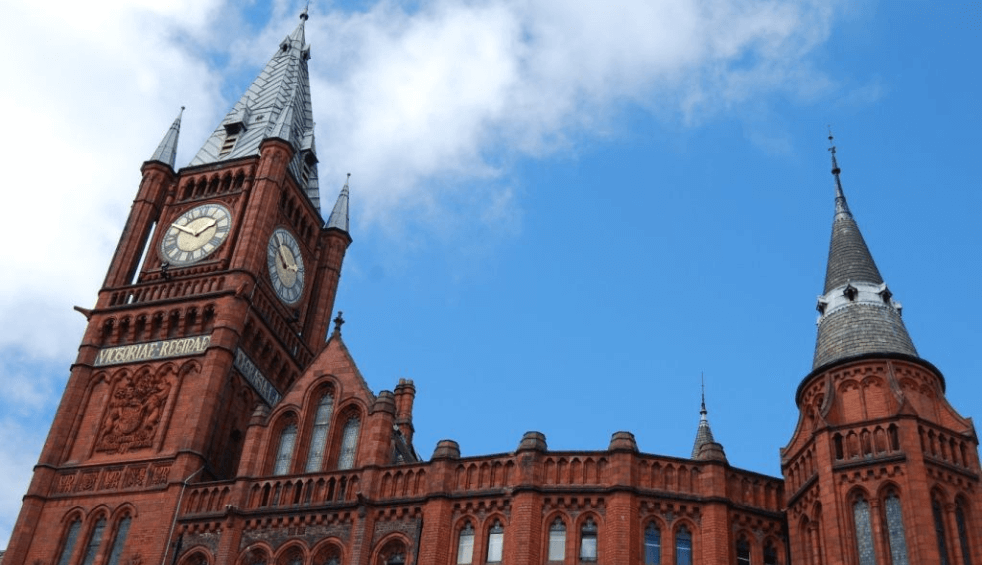 Outside of the Victoria Gallery with an ornate brick building and blue skies.