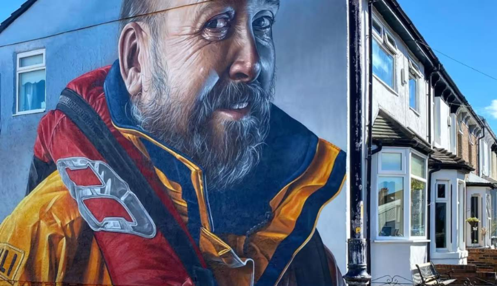 A mural of a sailor on a house in New Brighton