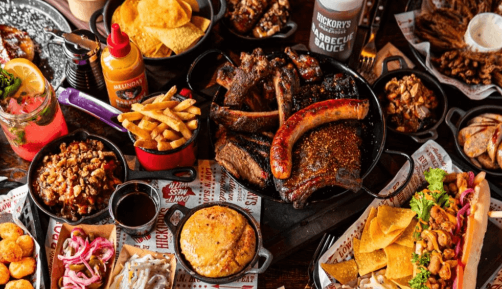 A table full of BBQ meat platters at Hickory's Smokehouse
