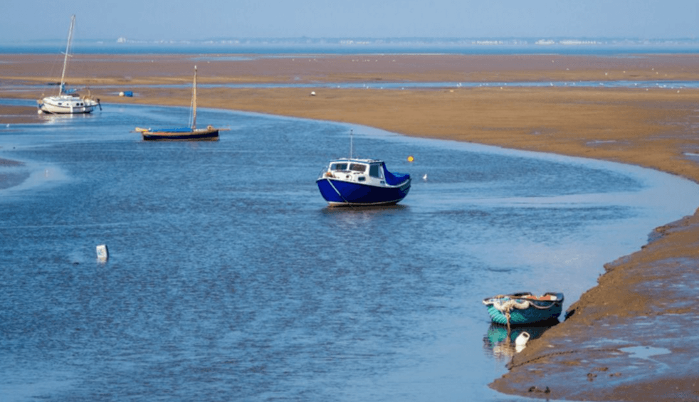 Boats moored on the beach at Leasowe Bay