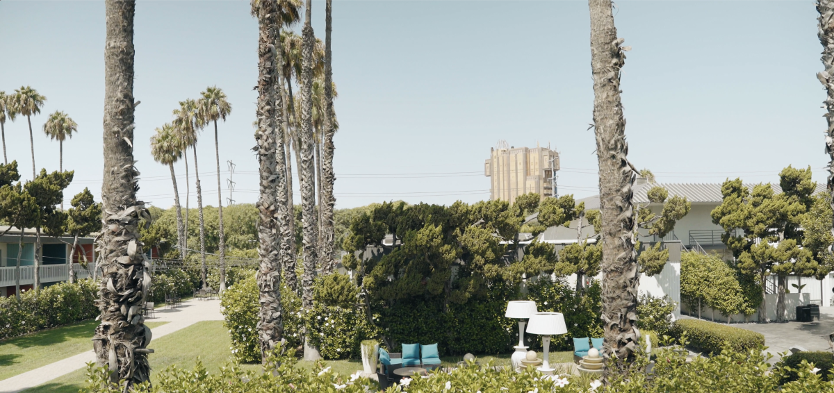 View from a room at The Anaheim Hotel. The image overlooks the hotel grounds and Disney California Adventure Park is seen in the background.