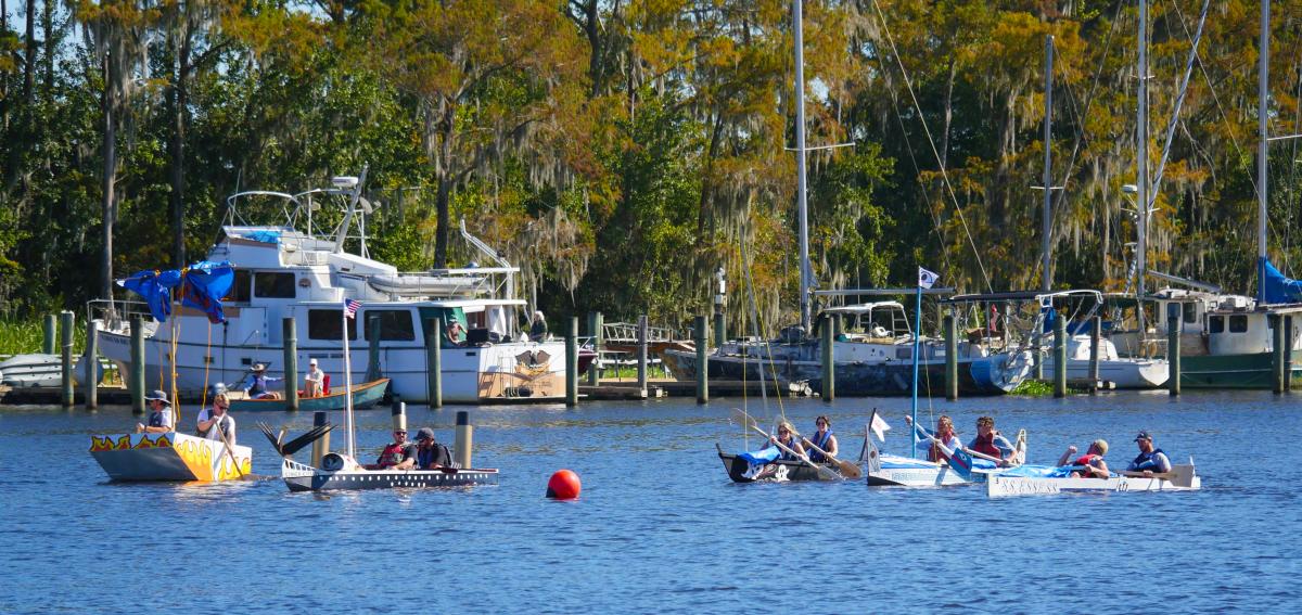 Teams race handmade boats across the Tchefuncte River during the Quick ’n Dirty Boat Building Contest at the Madisonville Wooden Boat Festival.