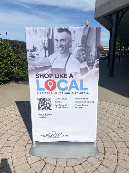 signage at a mall promoting local stores