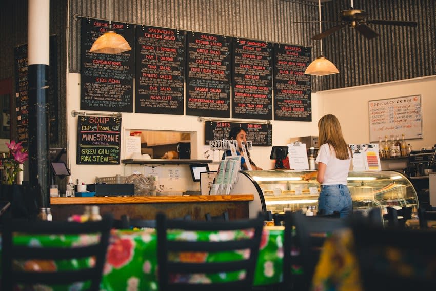 Woman ordering at the counter at Red Bud Cafe in Blanco Texas