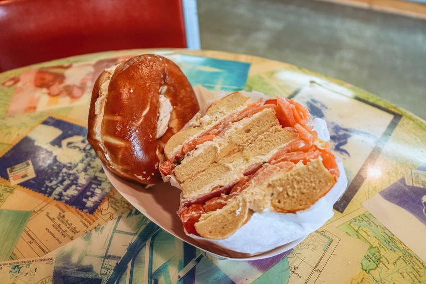 A bagel sandwich and bagel with schmear from Bloomington Bagel Company