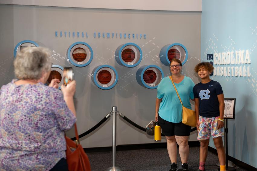 Person Taking Photo of People at Carolina Basketball Museum