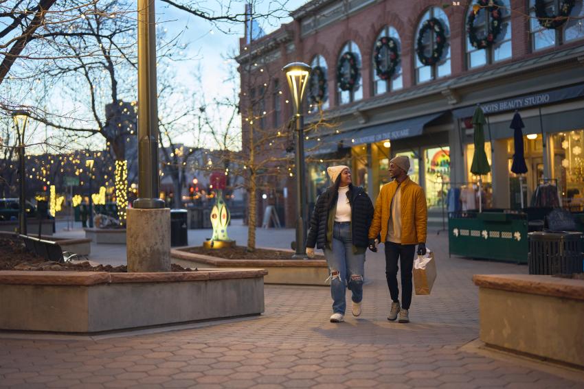 Couple shopping and walking through downtown in winter