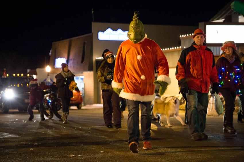 The Grinch and others walking in the Holiday Parade down Third Street in Marquette