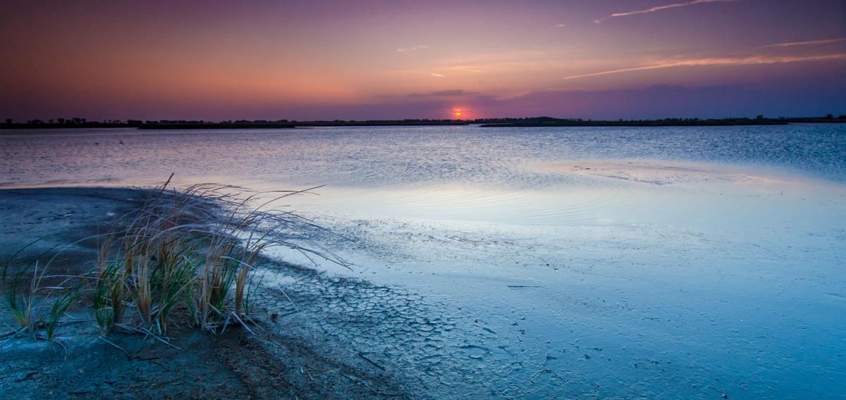 After sunset, a blue sky over water