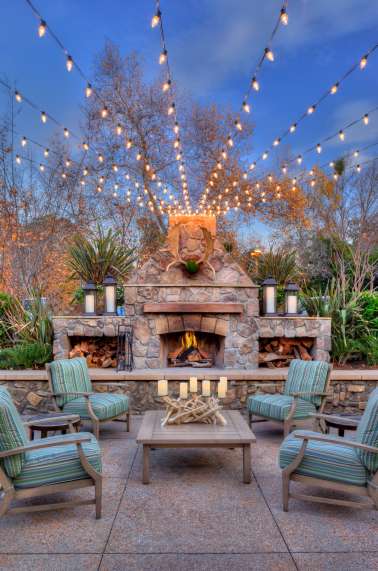 Outdoor seating area with market lights.