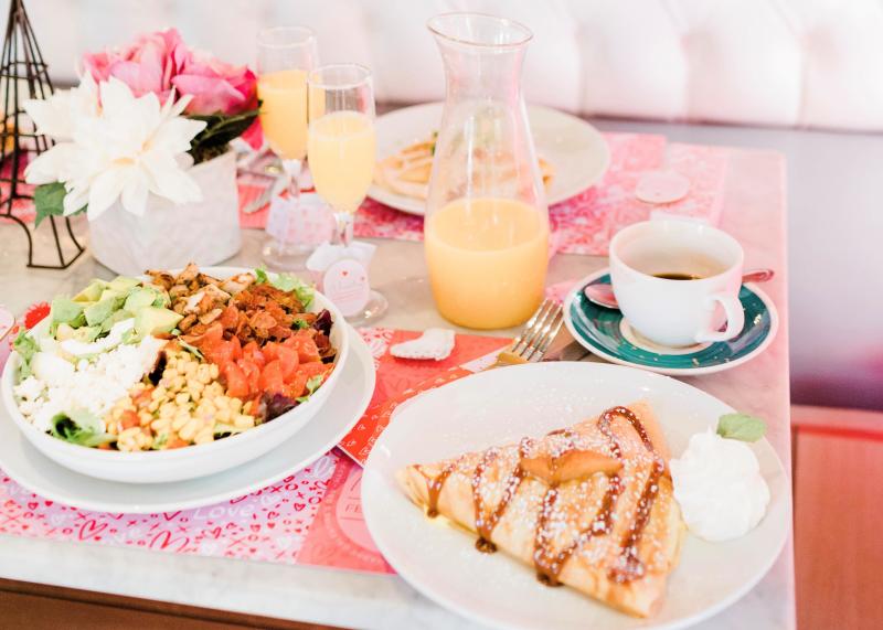 Sweet Paris brunch spread with crepes, mimosas, salad and coffee