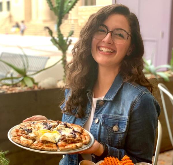 Enjoying pizza in Jupiter Pizza & Waffle Co.'s patio dining area located at Sugar Land Town Square.