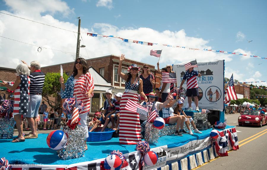 a 4th of July parade float with people waving