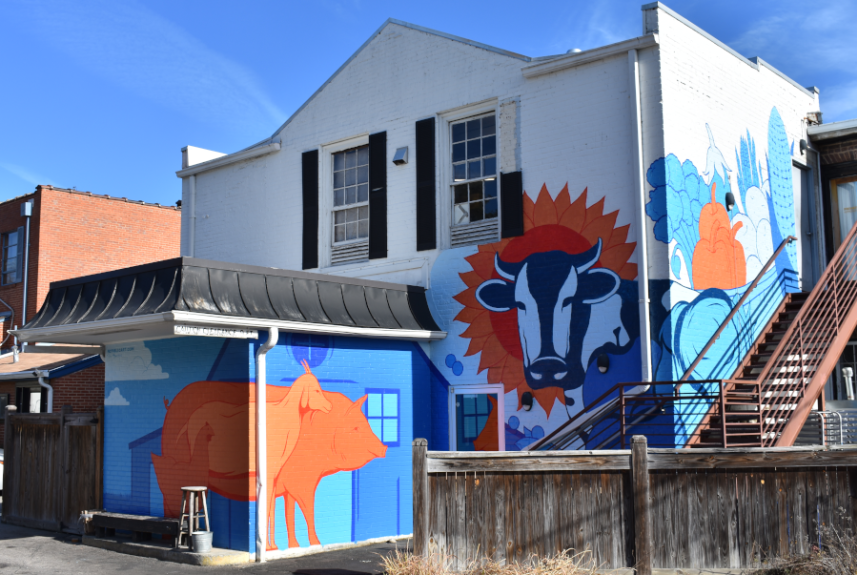 Mural on the back of the Wooden Nickel building in Downtown Hillsborough, shows farm animals and crops