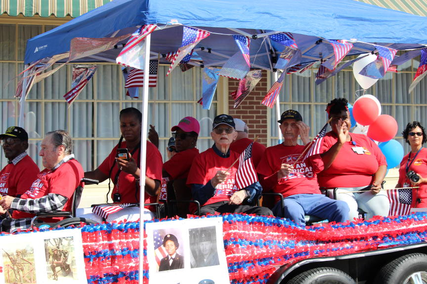 veterans riding on a trailer