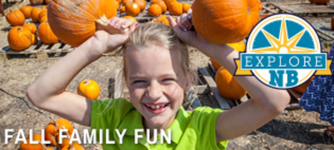 A young girl having fun at a pumpkin patch in New Braunfels, Texas