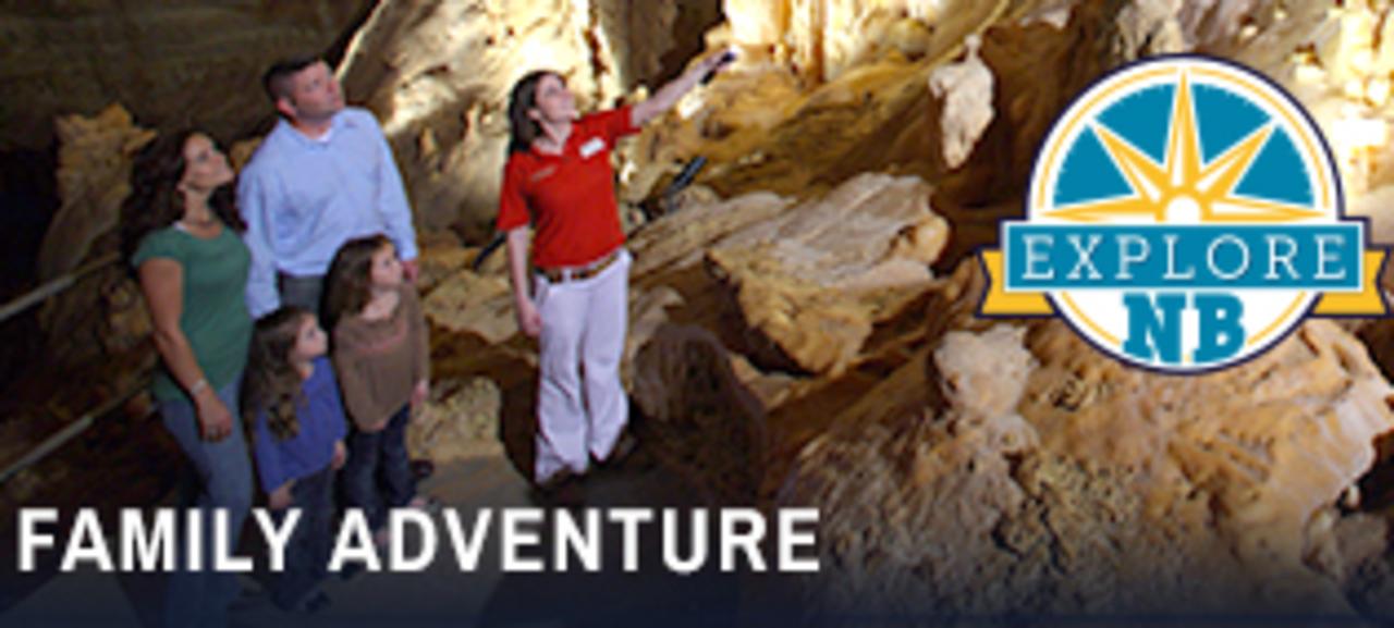 A family of four and a tour guide explore an underground cave at Natural Bridge Caverns, located just outside New Braunfels, Texas.