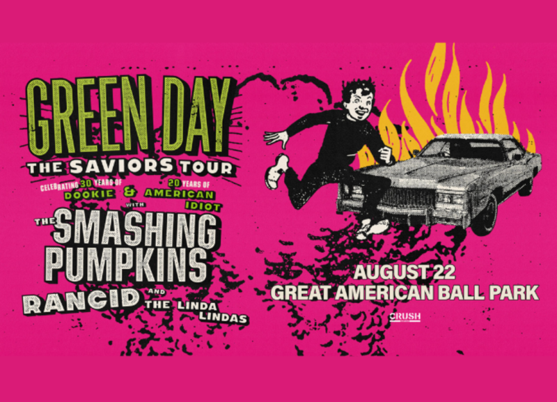 Image is of the Green Day poster featuring a guy running from a car on fire that say's "Green Day the Saviors Tour on August 22 at Great American Ballpark".