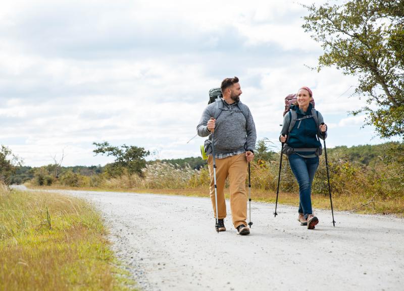 two people hiking through trail