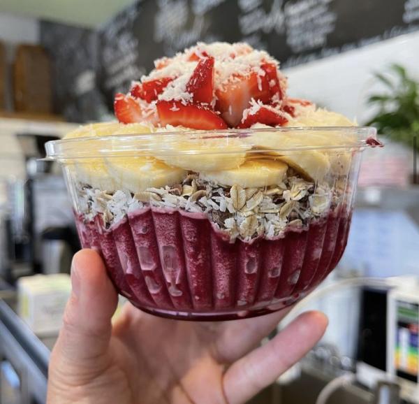 Acai bowl in a persons hand.