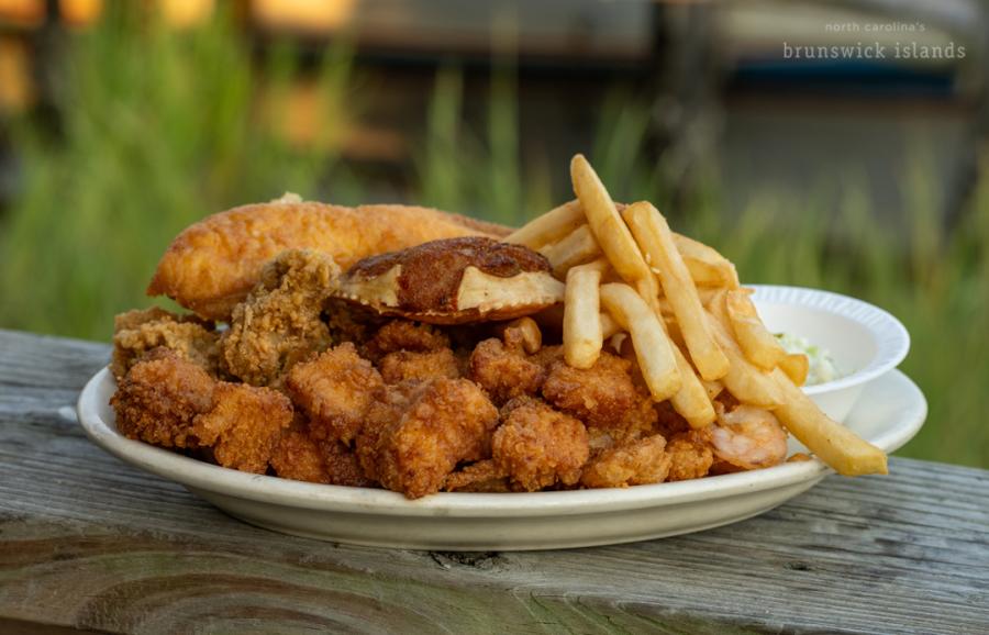 A plate from fried seafood with a side of fries