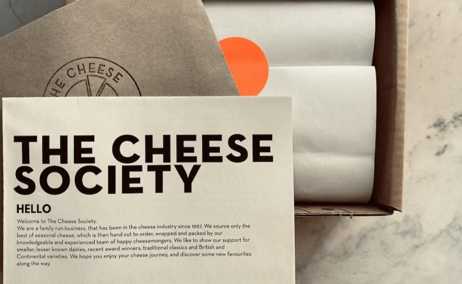 picture of a label with The Cheese Society's logo and a welcome message