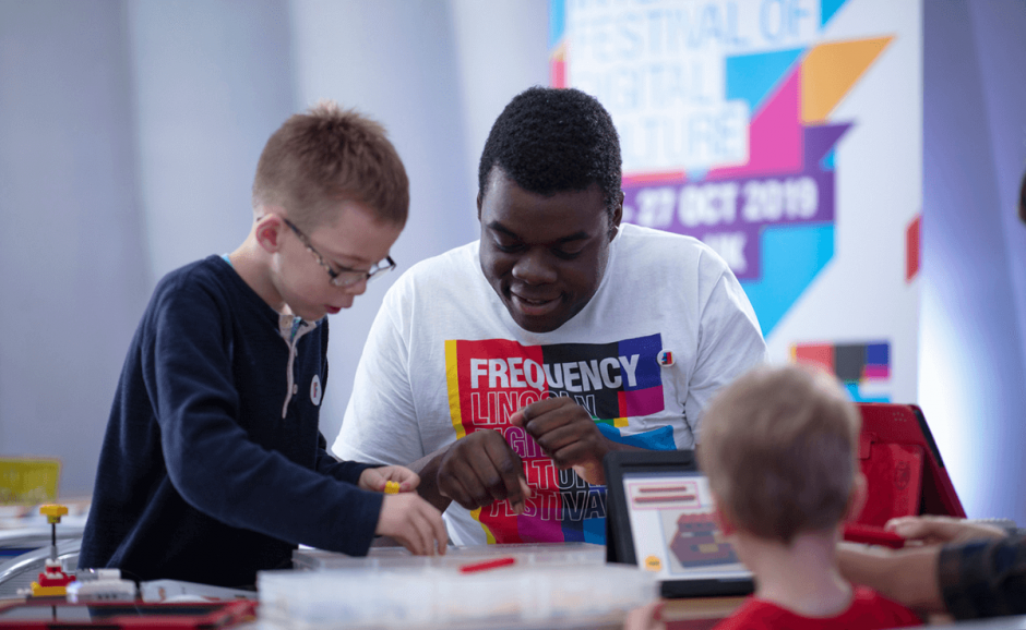 Frequency team member carrying out an activity with children in Lincoln