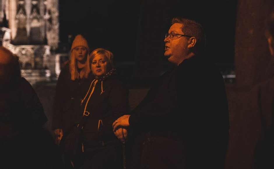 people gathered together for a Ghost Walk event late at night