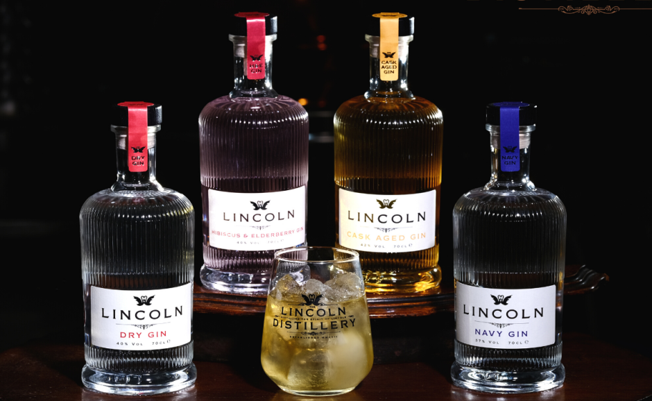 a picture of 4 bottles and different flavours of gin