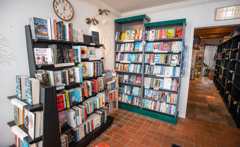 Shelves of books in a cosy building.