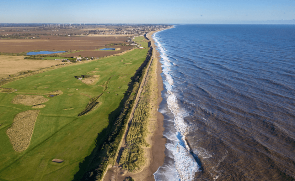 a split view of the fields and the sea
