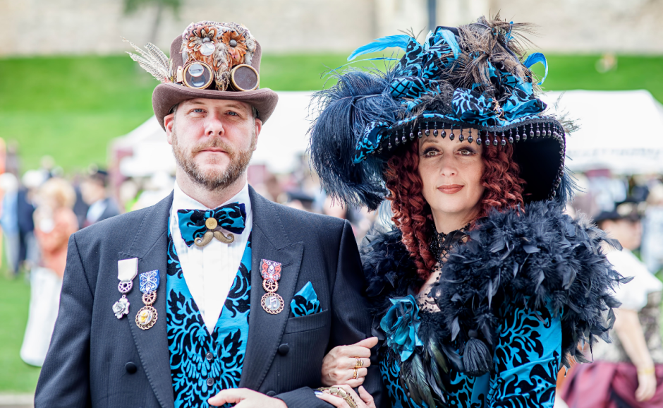 two people in fancy costumes at Steampunk