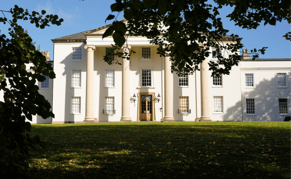 An image of a centuries old mansion on a country estate.