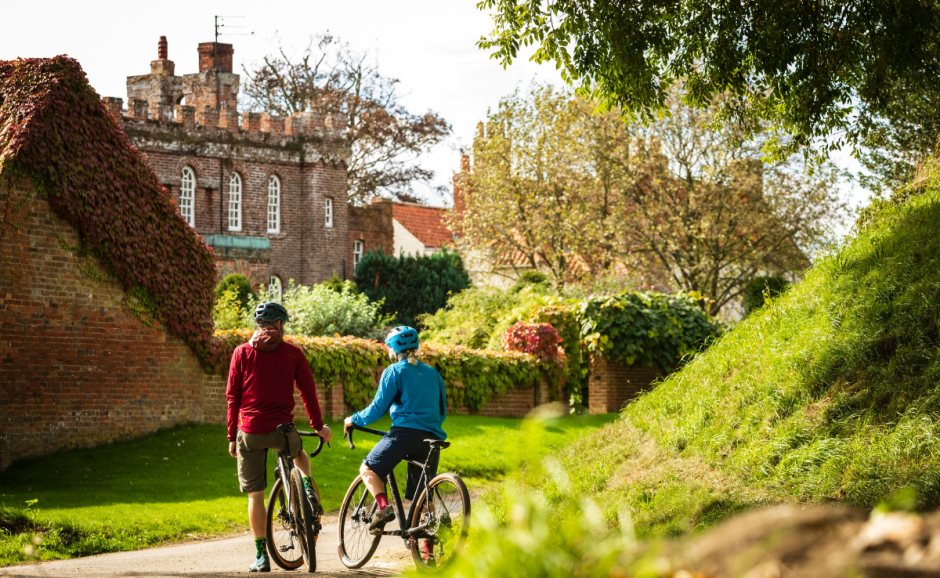 two people riding bikes along a nature trail in Lincoln