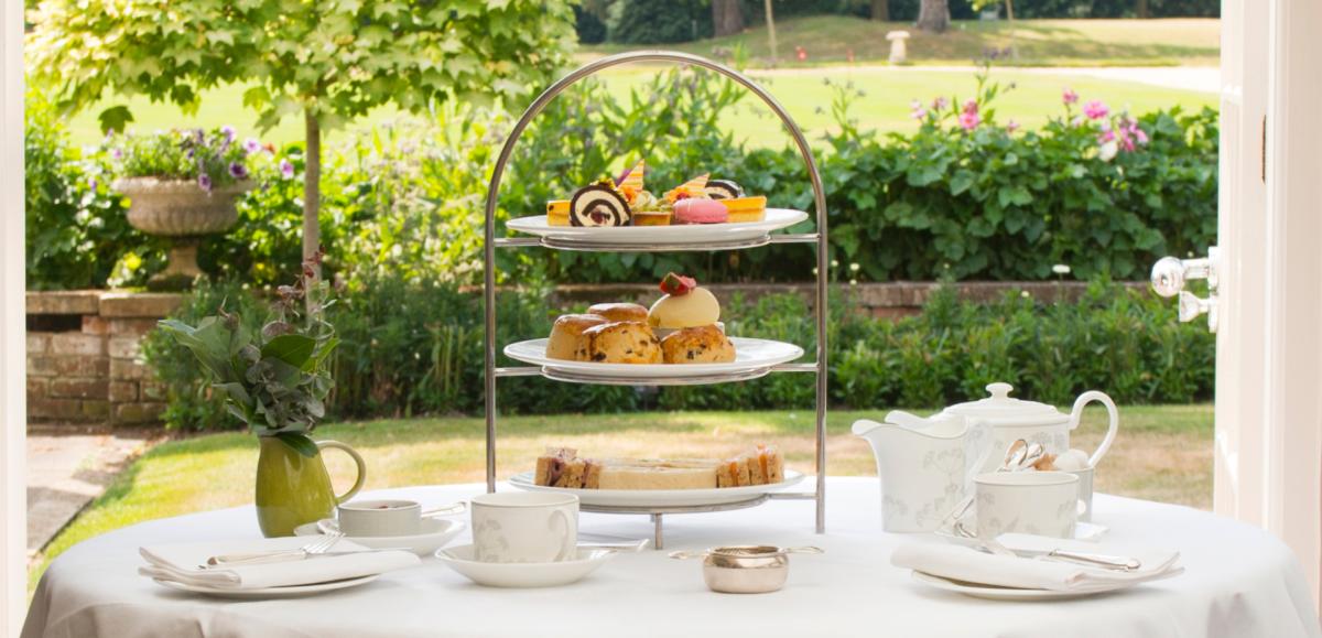 Afternoon tea in restaurant looking out to garden in the New Forest