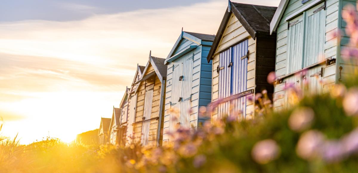 Beach huts and flowers at Milford on Sea on the New Forest Coastline