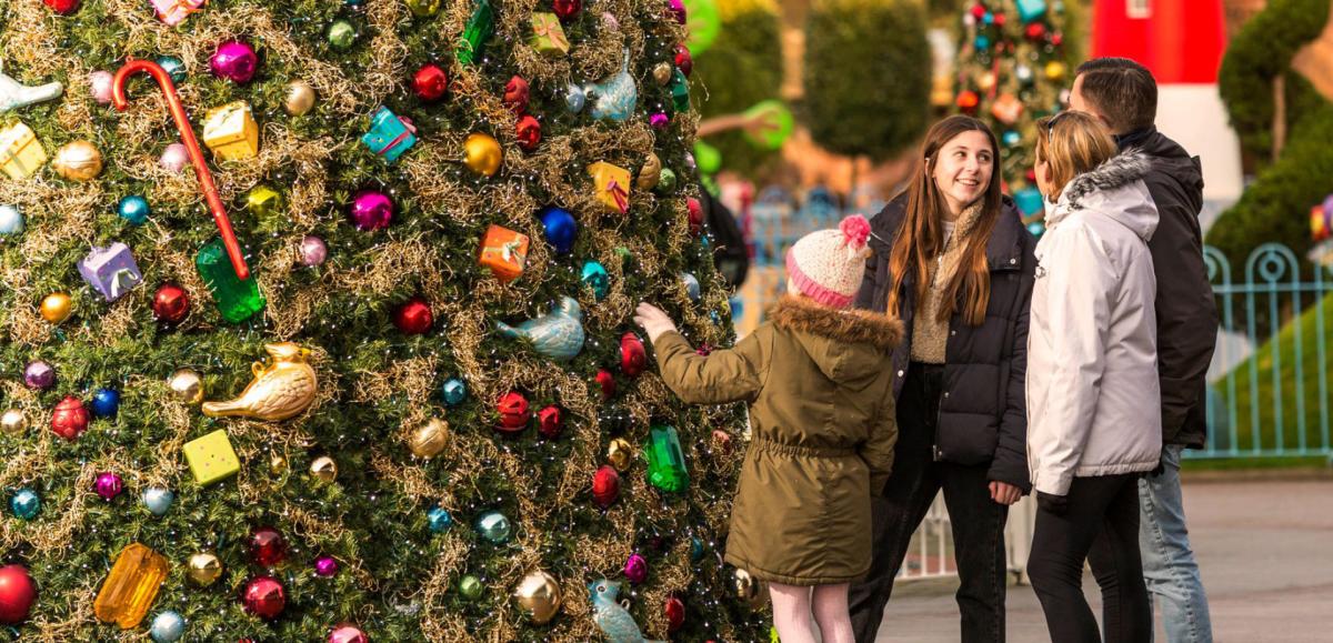 Family by Christmas Tree at Paultons Park in the New Forest