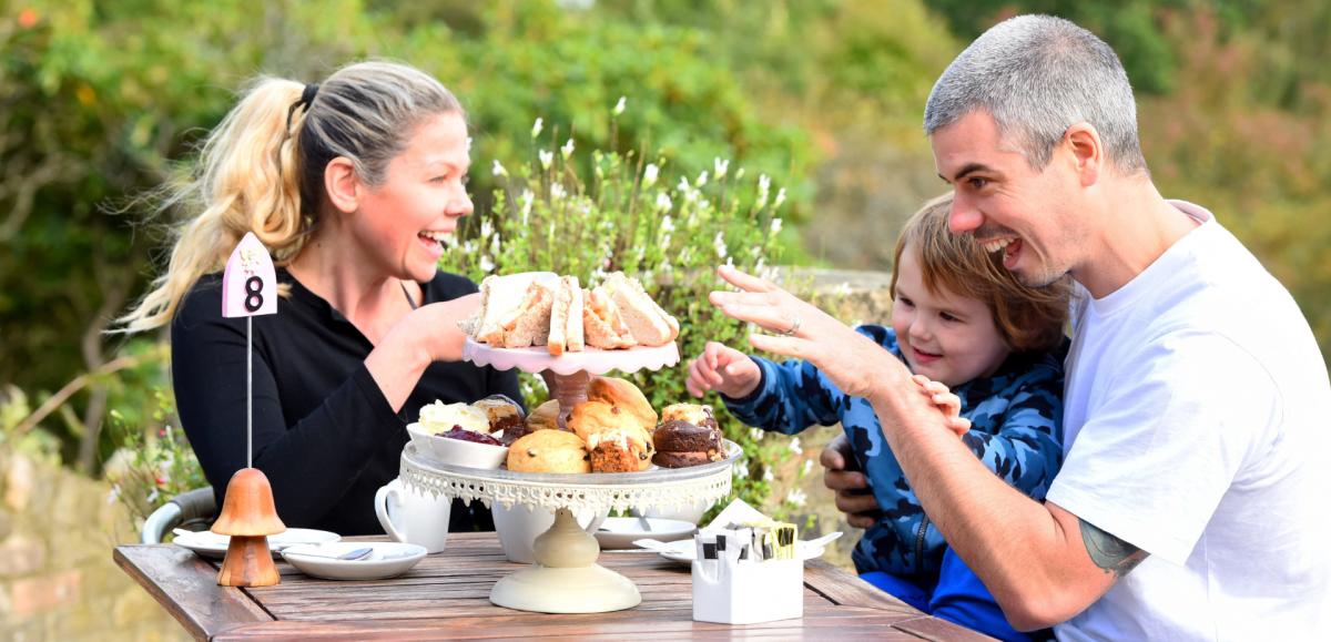 Family having afternoon tea at Furzey Gardens Tearooms in the New Forest