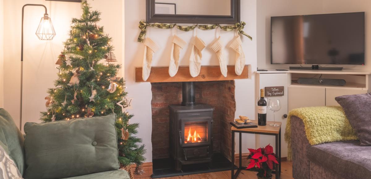 Self catering cottage lounge decorated for Christmas in the New Forest